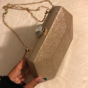 A gold glitter handbag, only used once for Prom